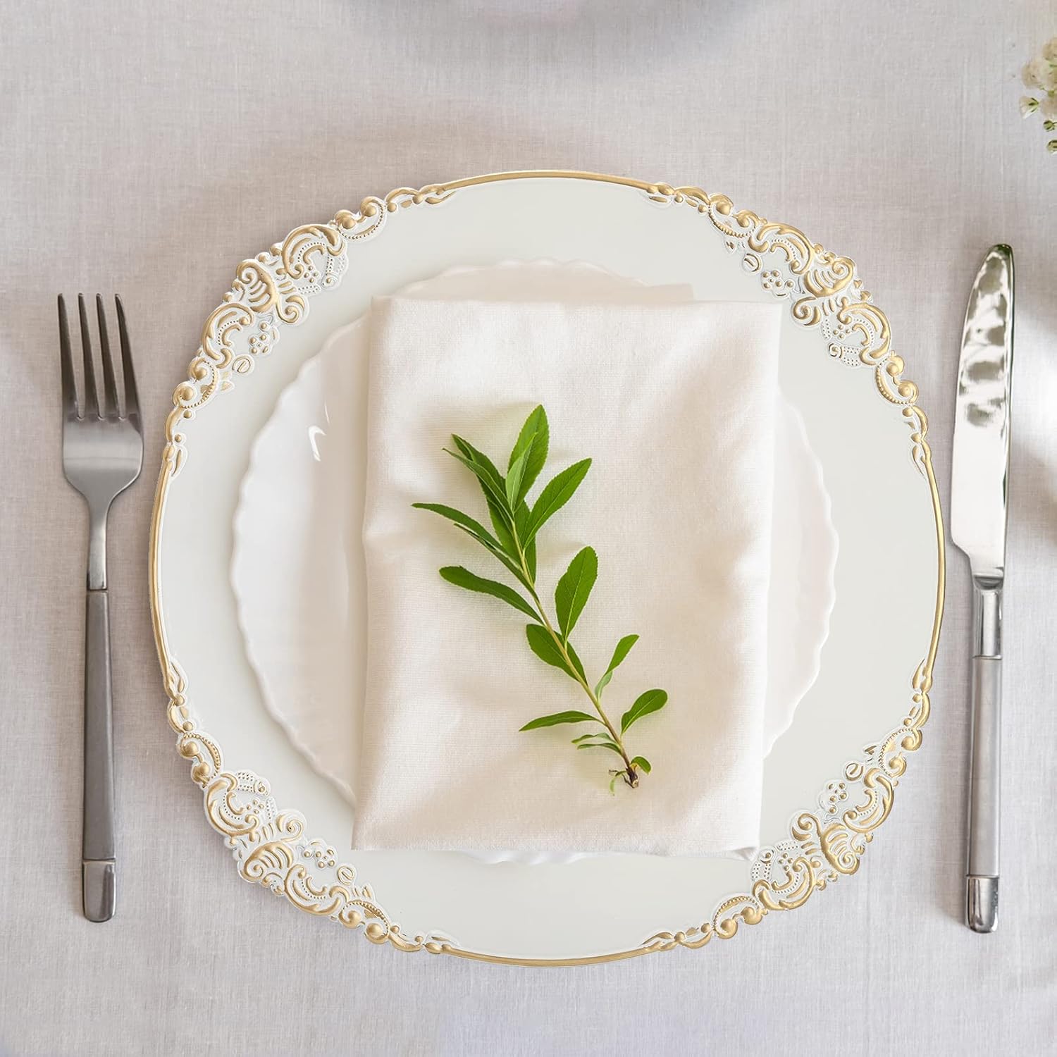 12 white floral-trimmed charger plates with gold rims for elegant wedding catering. - Image 5